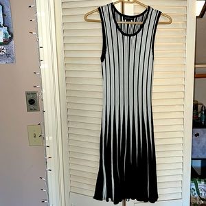 Black/white straight dress with flair at the bottom